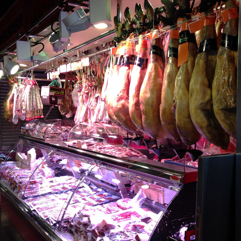 Hams waiting to be sold at the Mercat de Sant Josep de la Boqueria